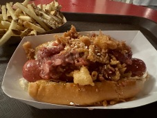 50th Celebration Hot Dog with strawberry bacon jam, funnel cake pieces, and powdered sugar!